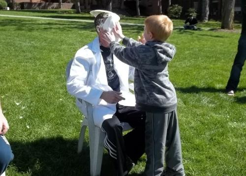 professor getting pied by a child