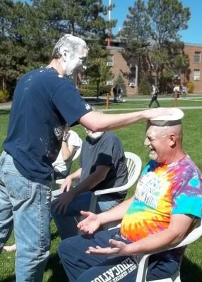 professor getting pied on top of his head