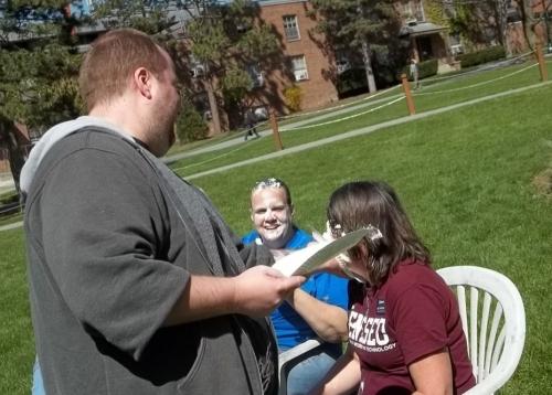 student with professor after getting pied