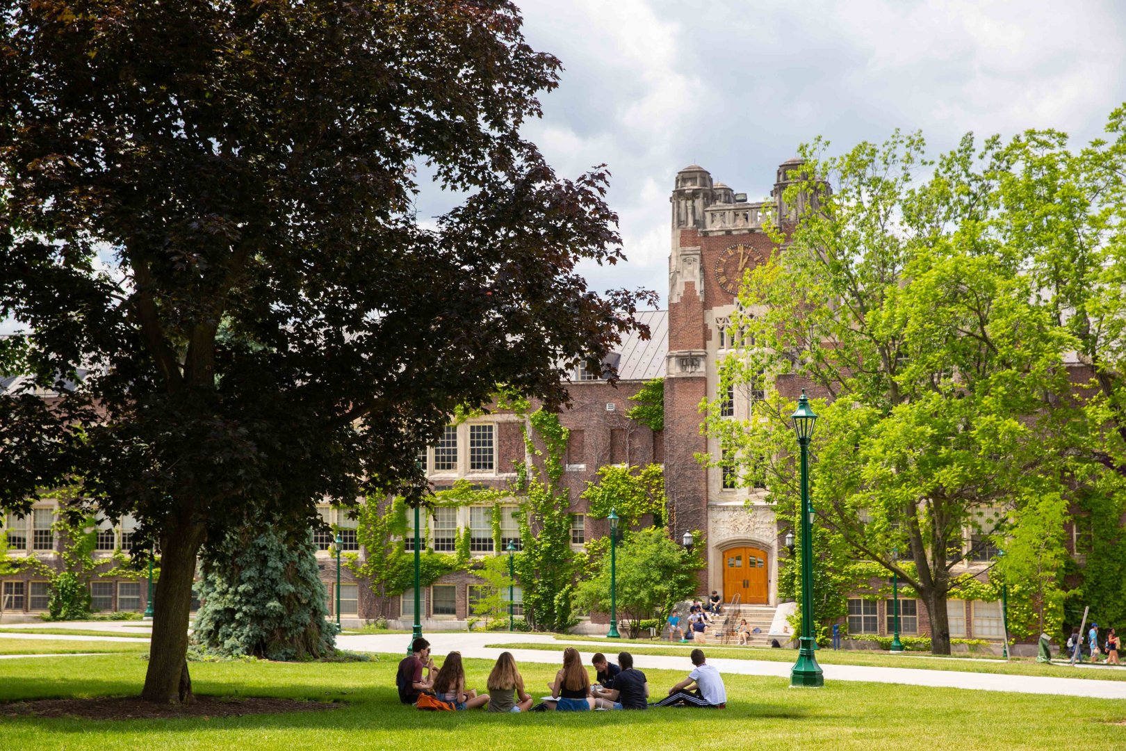 Campus scene with students on the green