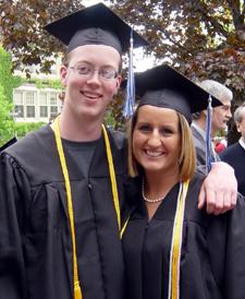 Two graduates posing for a photo.