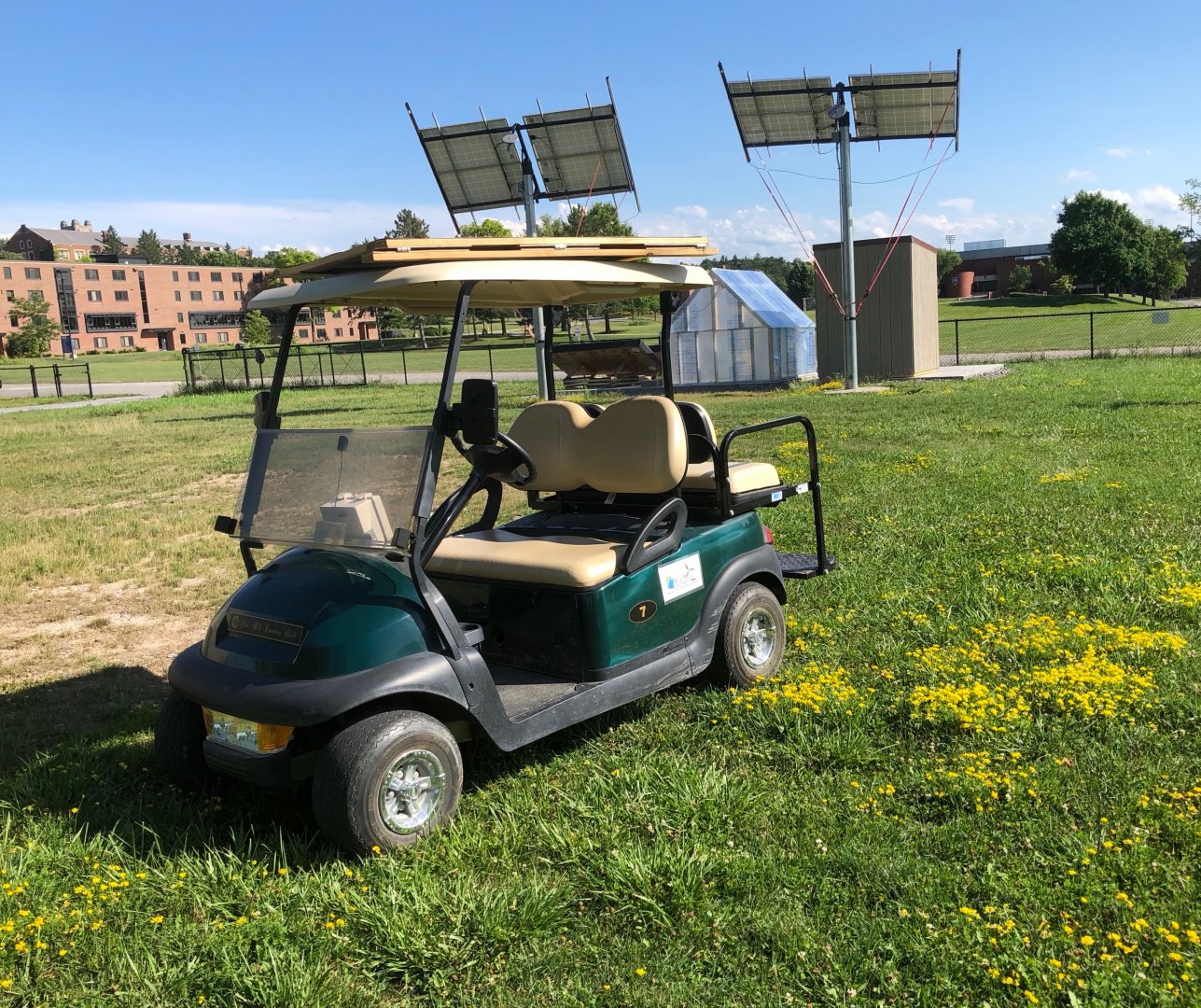 The eCart parked in front of the solar array in the eGarden.