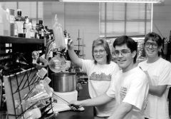 Students working in an lab, black and white.