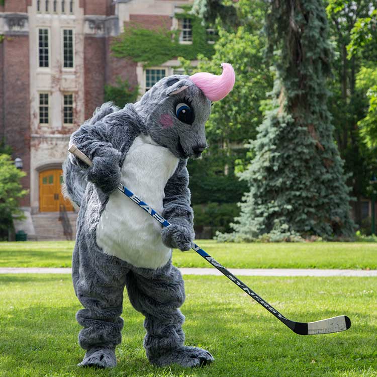 Genny the WGSU mascot with a hockey stick