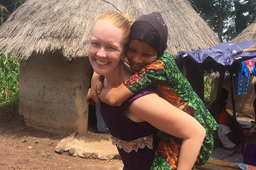 Jessica Kroenert '15 with a child from her village in Senegal.