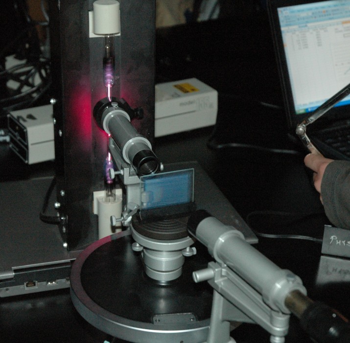 spectrometer aimed at hydrogen gas tube