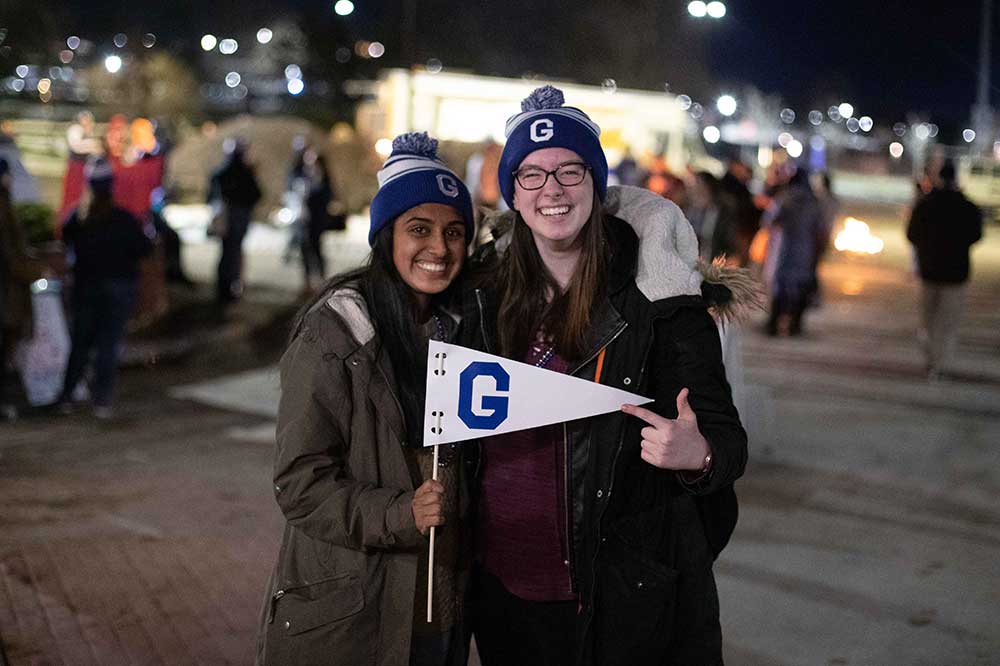 two students at tailgate party