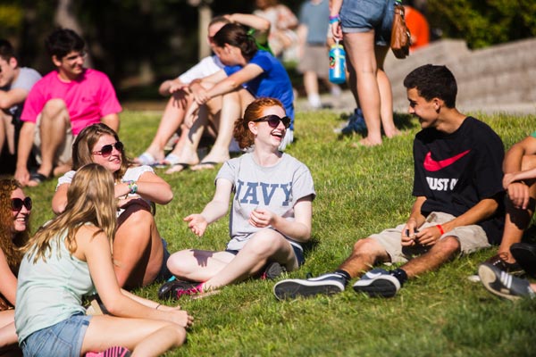 Students hanging out on green