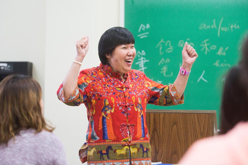 professor teaching students a foreign language