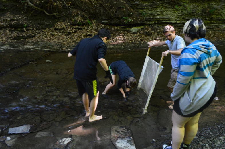 students in a river