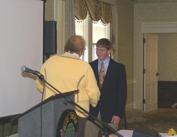 Professor Meg Stolee presents a paper prize to Seth Molloy