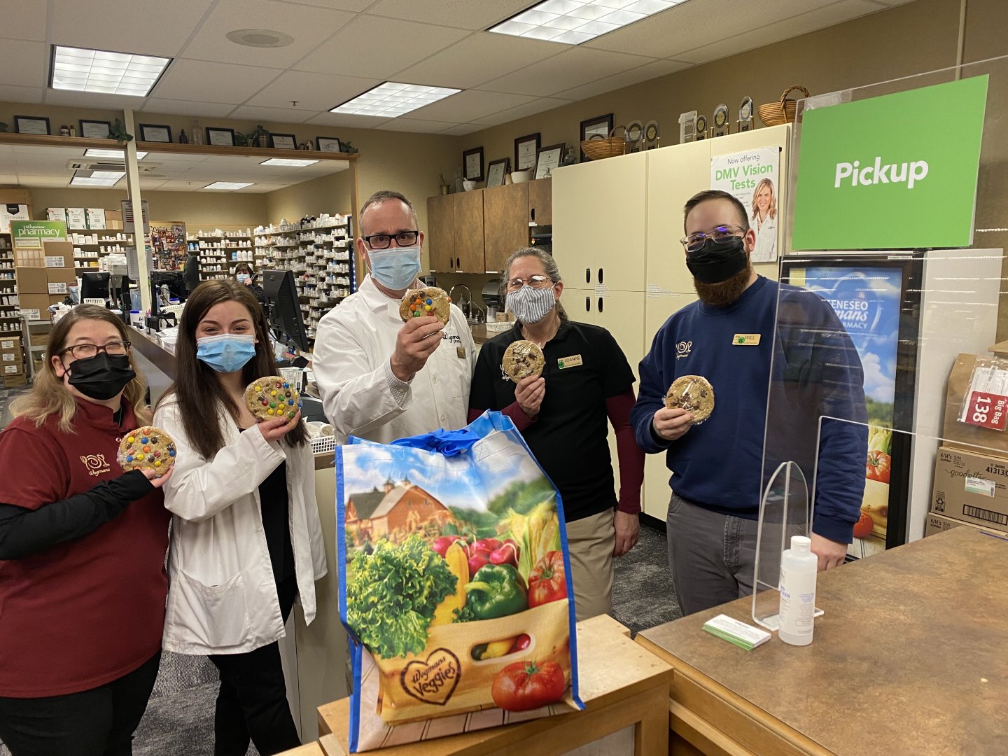 staff at wegmans pharmacy getting cookie donations