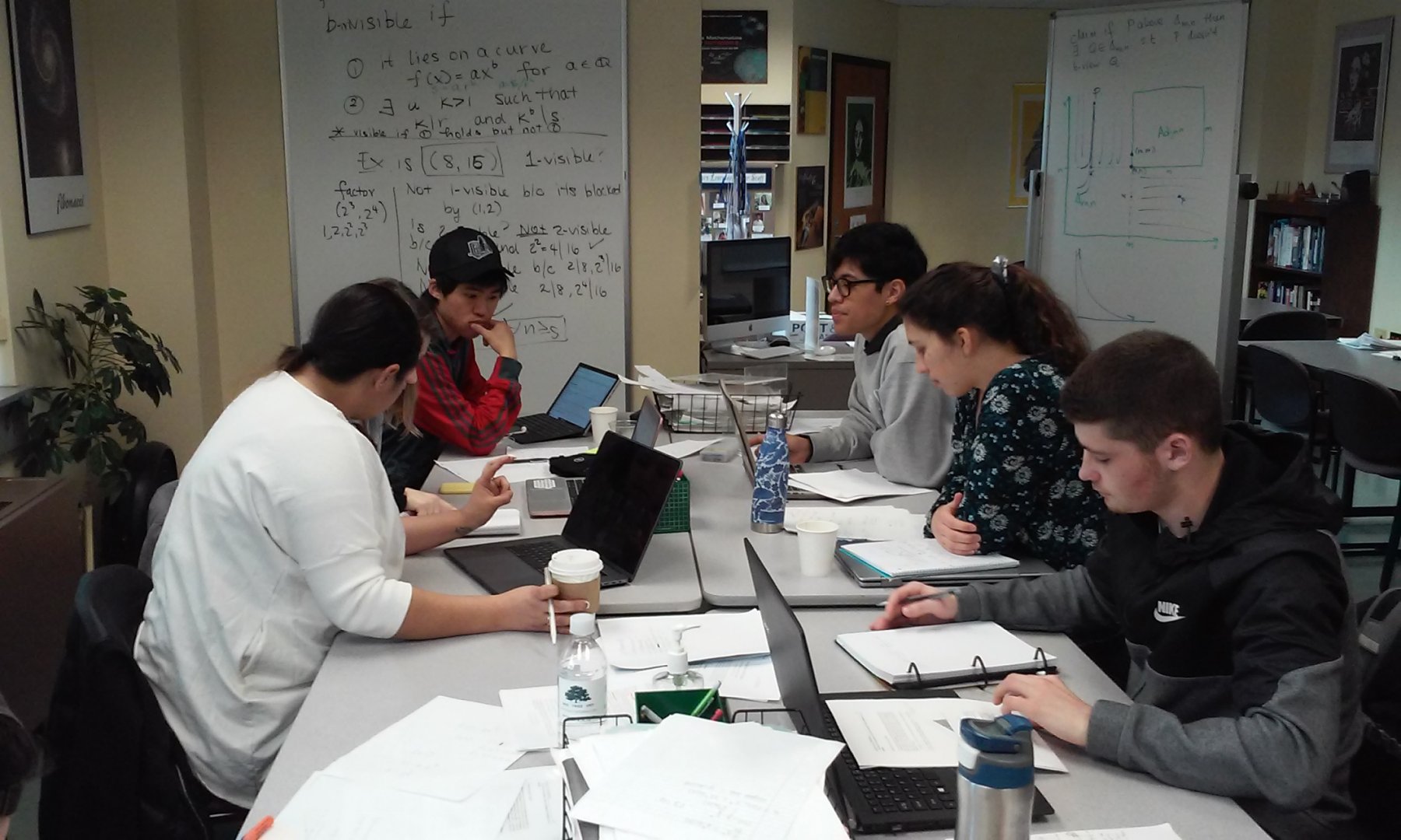 Dr. Pamela Harris lead a group of students working on a problem on Invisible Lattice Points.2
