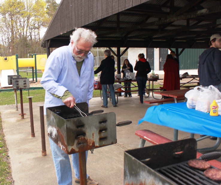 PRISM Math Club: An old man cooking his food at the picnic