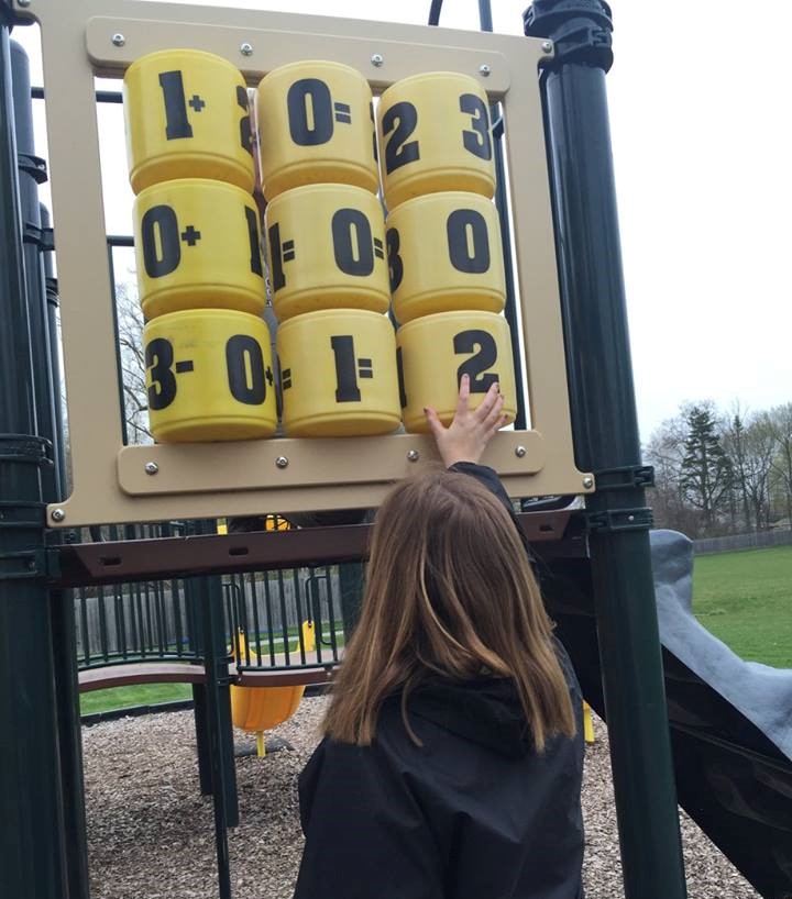 PRISM Math Club: A student plays on the playground