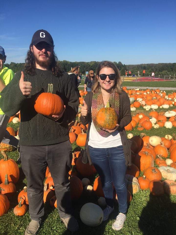 PRISM Math Club: Two students holding pumpkins