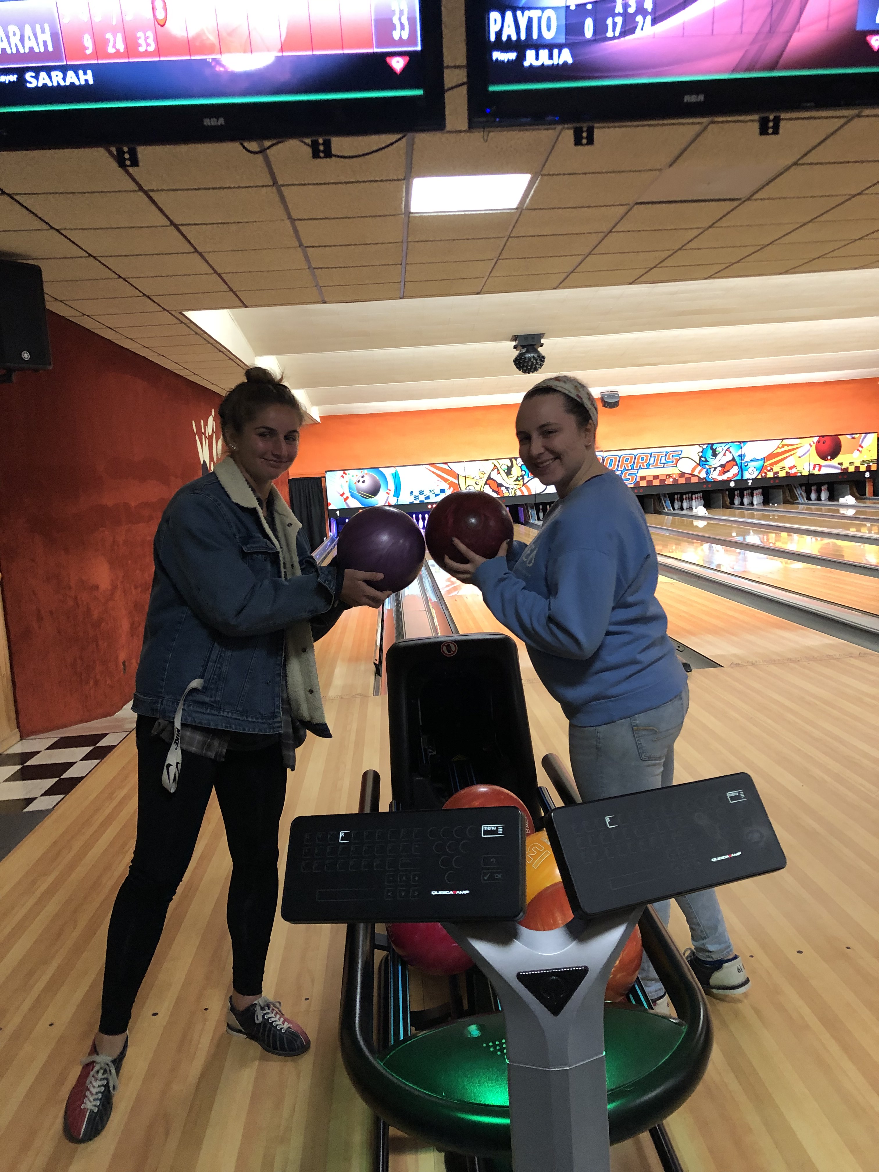 Two students preparing to bowl
