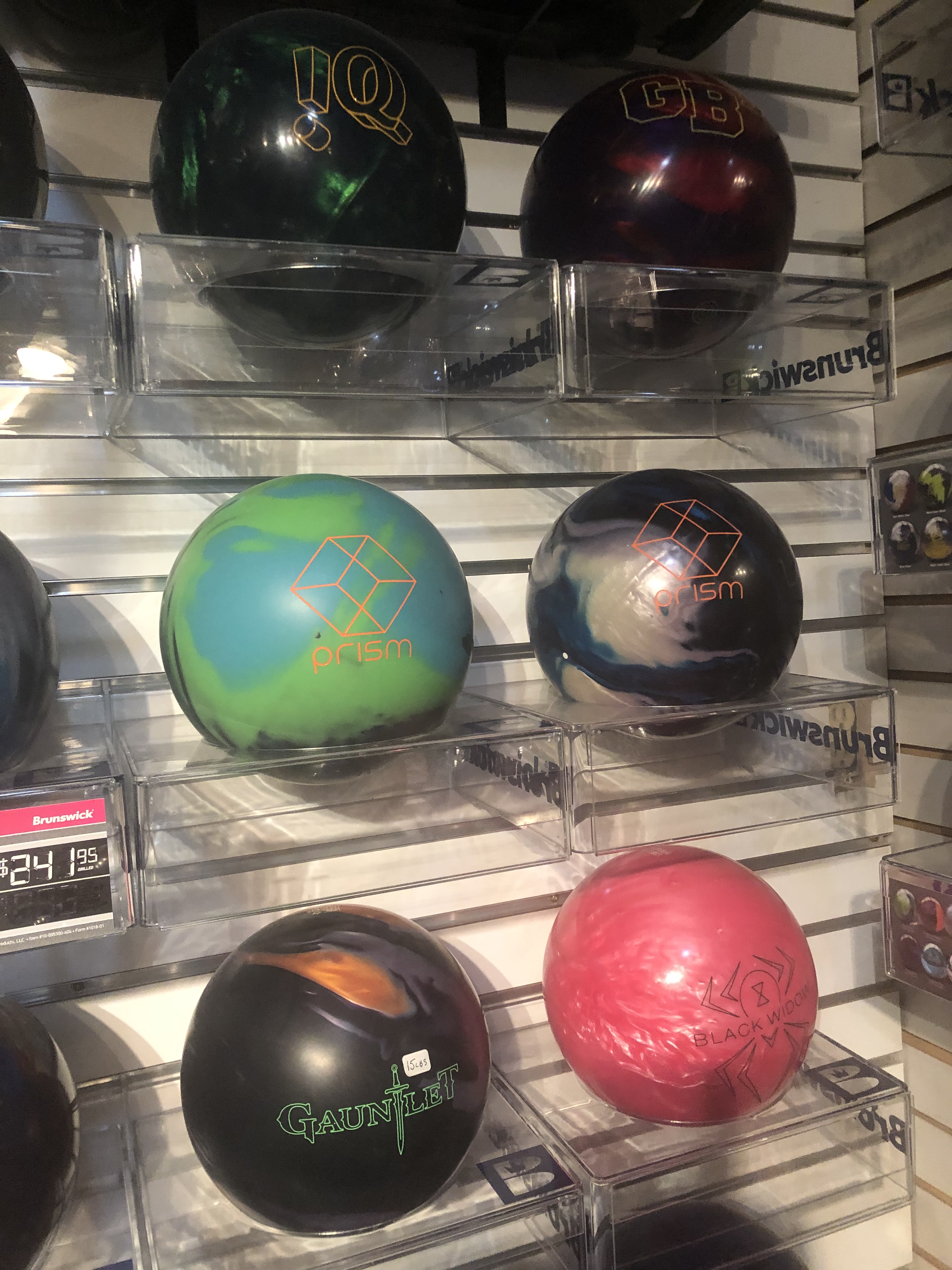Bowling balls with prism written on them