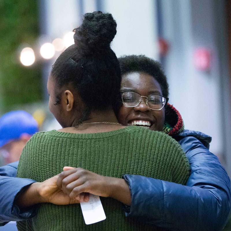 students hugging