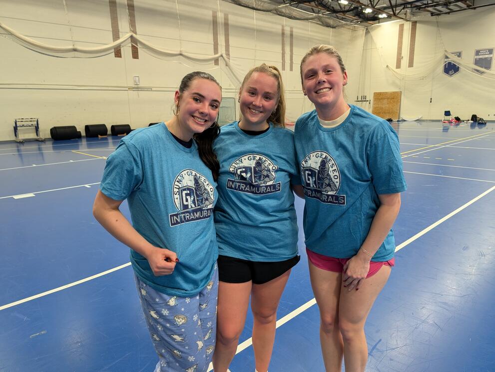3 basketball champions wearing blue intramural t-shirts.