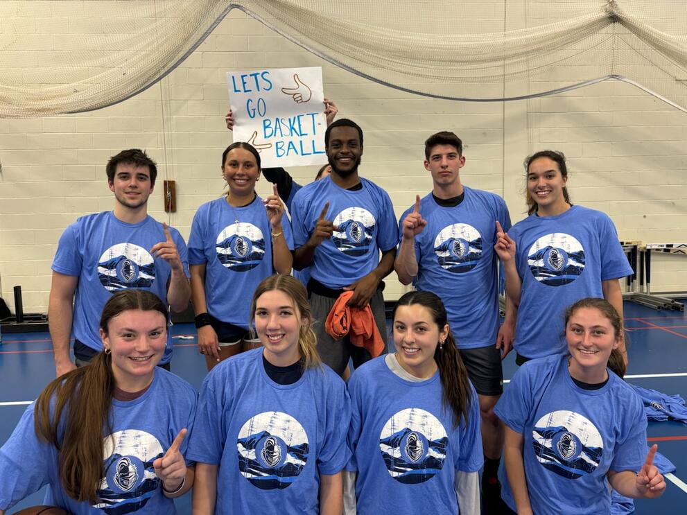 Group of basketball champions wearing blue intramural t-shirts.