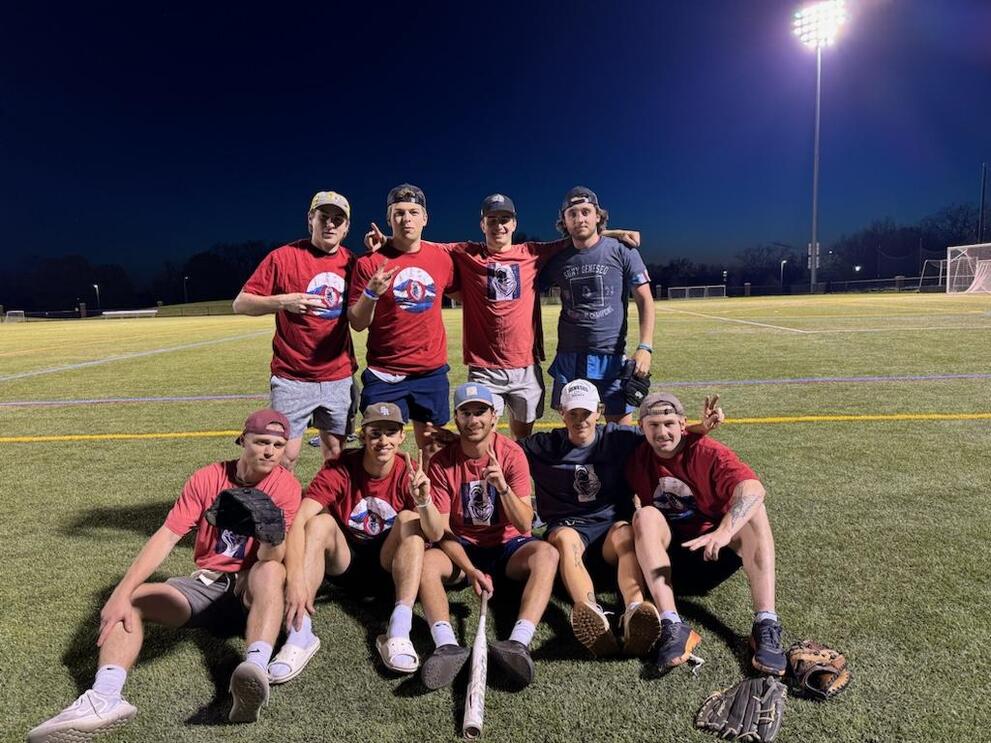 2 softball champions wearing red intramural t-shirts.