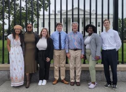 Geneseo students stand with Professor Jeff Koch in front of the White House in Washington, D.C.