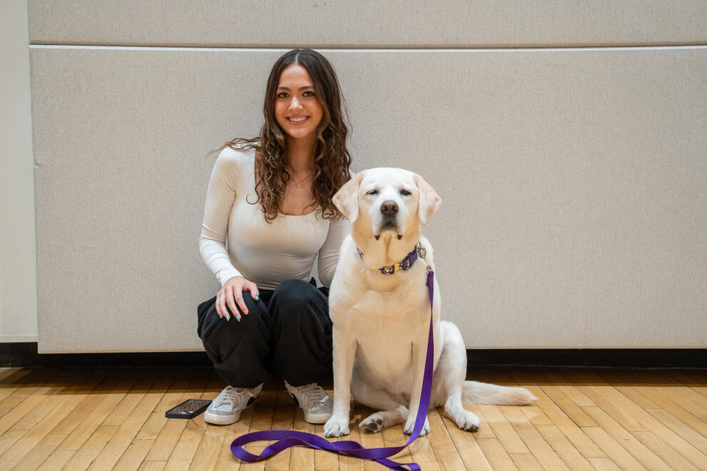 Julia Candee posing with therapy dog.