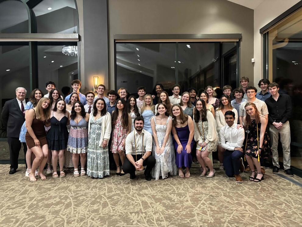 Alpha Kappa Psi members together at the Spring 2025 Banquet.