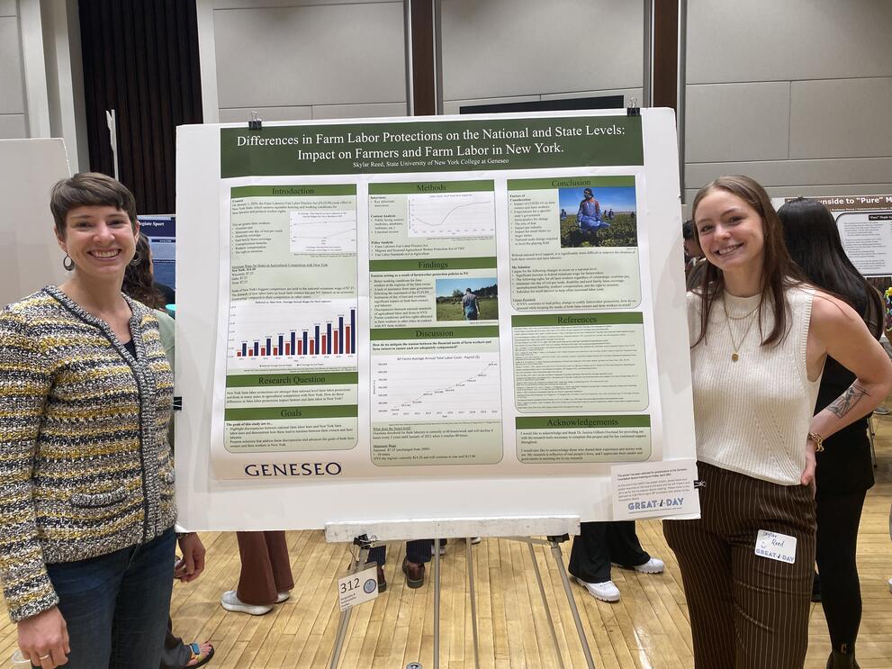Photo of student presenting poster