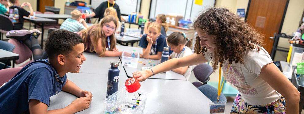 Students in the classroom performing experiments