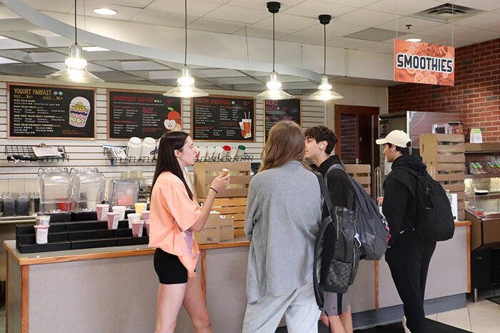 Students waiting for their custom orders at the Smoothies station in Mary's.
