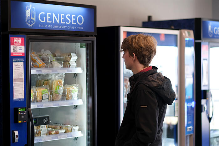 Student overlooks the options at the vending machines in MacVittie College Union.