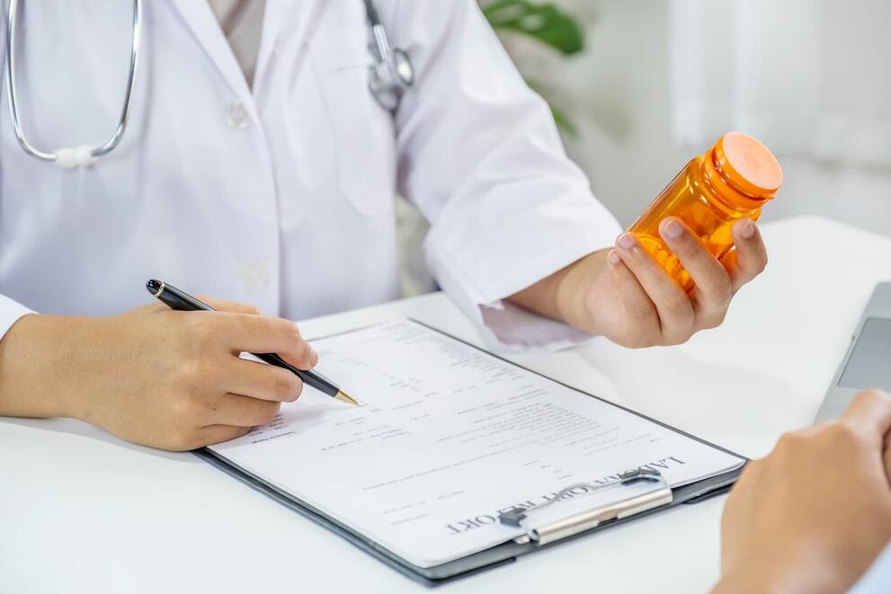 Pharmacist holding pills