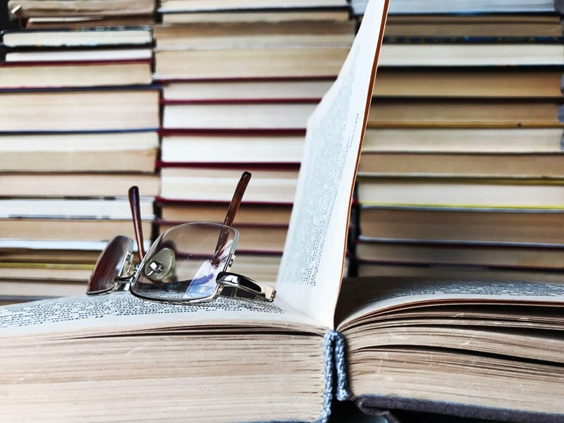 glasses on open book