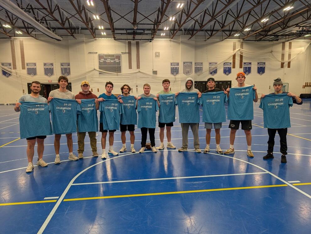 11 football champions holding blue intramural t-shirts.