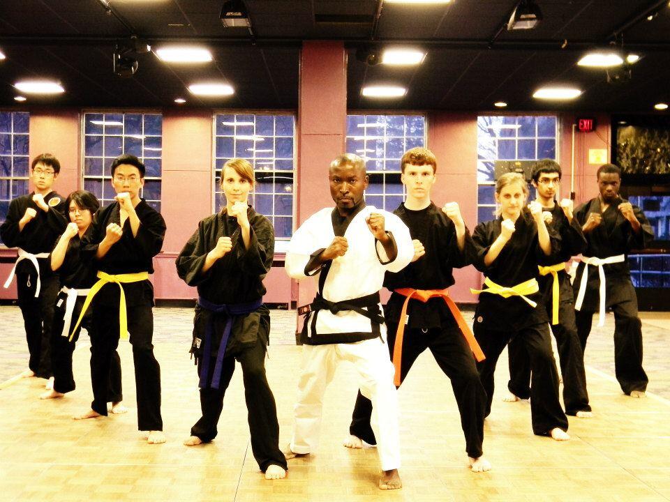 Photo of Dr. Adabra and students karate training