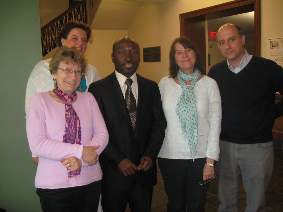 Photo of Dr. Adabra standing with four professors from NCSU.