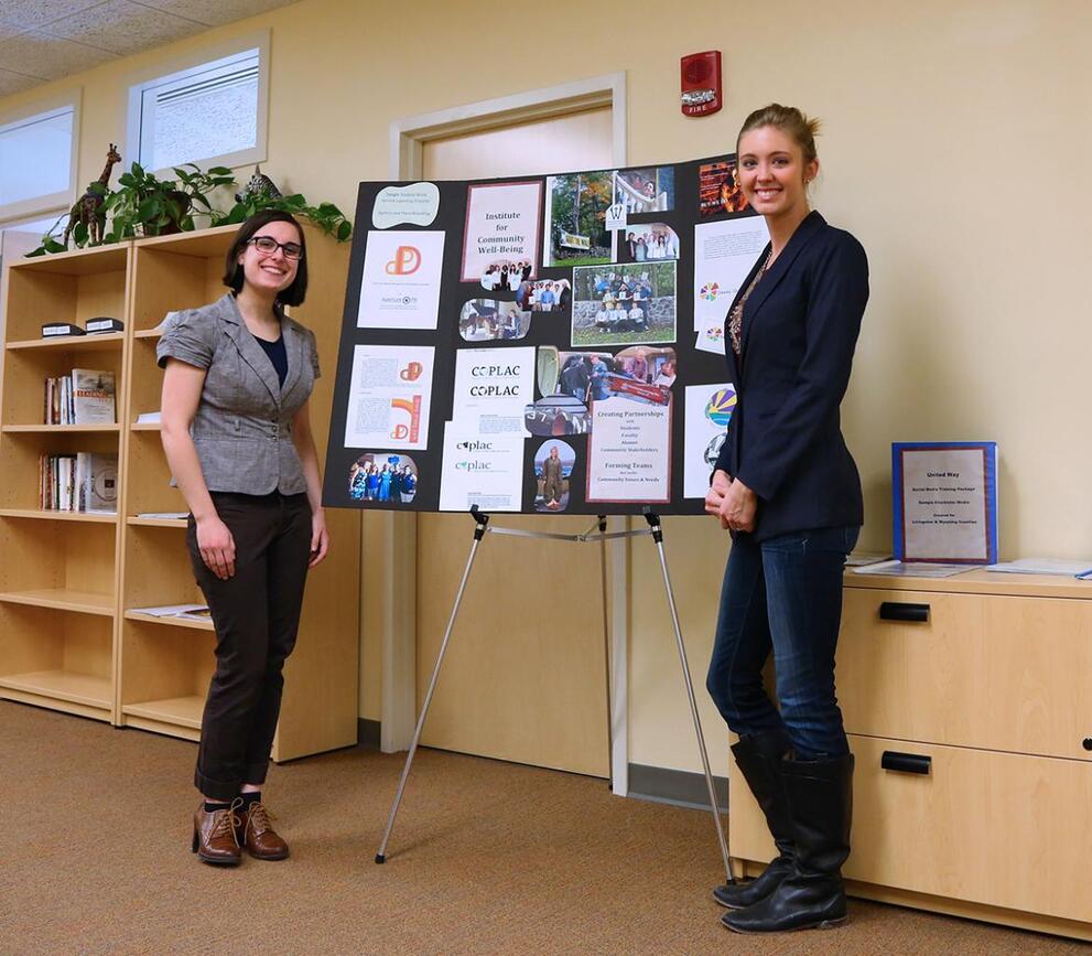 Two students presenting a poster.