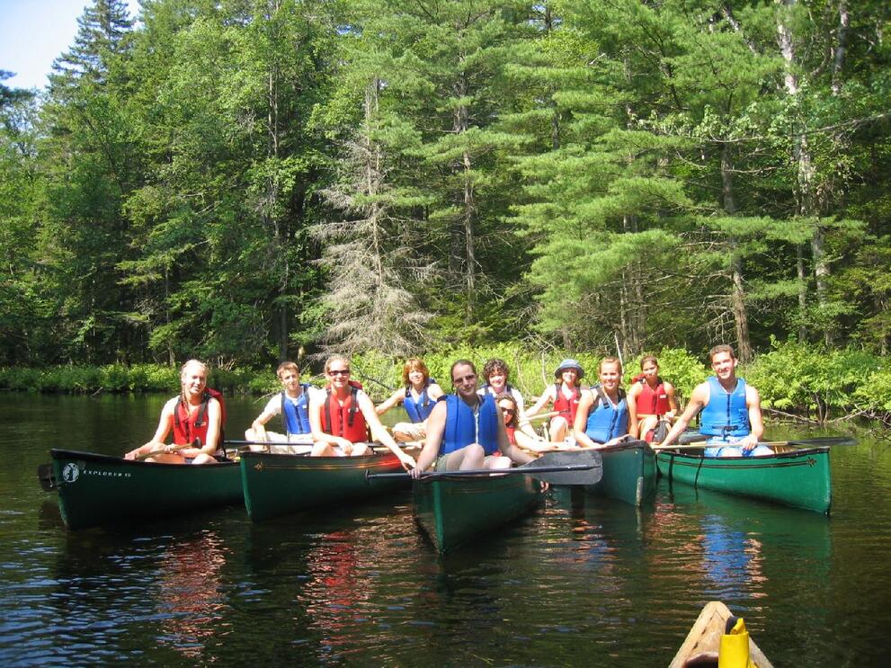 students on canoe