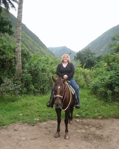 Colleen Garrity riding a horse.