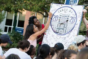 New students signing the class of 2020 photo