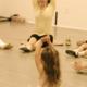 Jody DeLoria leading stretches in a dance class.