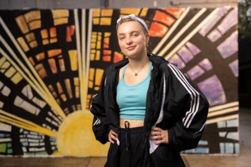 Cadence in front of the Brodie by Day mural