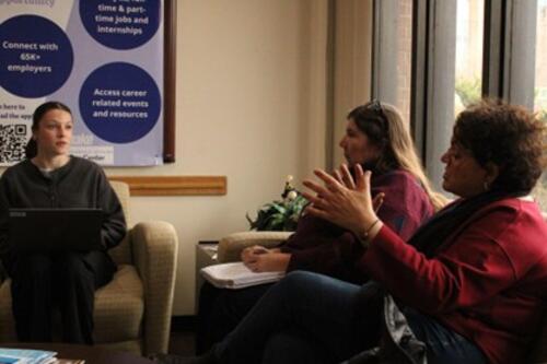 photo of student interviewing professors