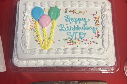 Birthday cake with "Happy Birthday STD" written on it