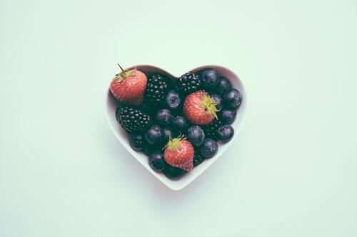 heart-shaped bowl with fruit