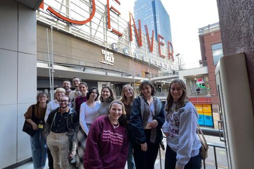 Sigma Tau Delta students gather to take a photo in Denver