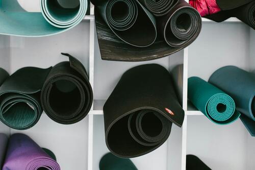 photo of yoga mats on shelf