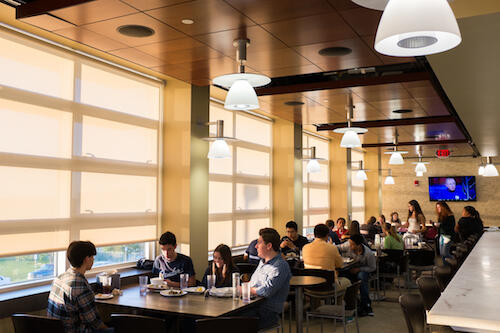 People eating at the dining hall.